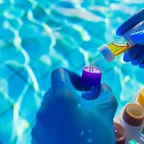 Pool Cleaning and Maintenance: How to Test and Adjust Calcium Hardness Pool Cleaning and Maintenance technician testing pool water to check calcium hardness levels for proper water balance