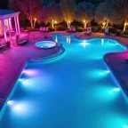 Pool LED Lights Installation: Safety Standards And The Importance Of Professional Help Pool LED Lights illuminating a luxury swimming pool at night
