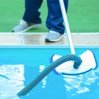 How Expert Swimming Pool Services Improve Villa Pool Cleaning with Advanced Vacuum Systems in Dubai Swimming pool services cleaning a villa pool with an advanced vacuum system for clear and hygienic water.