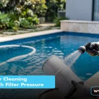 How Pool Filter Cleaning Can Lower High Filter Pressure a pool technician cleaning a cartridge filter with a hose beside a swimming pool, illustrating pool filter cleaning.
